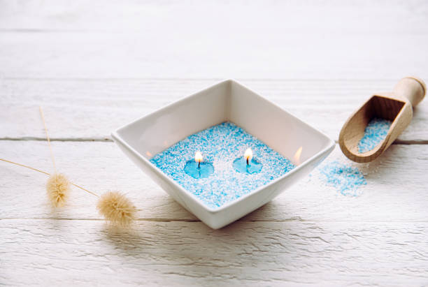 Close-up of a trimmed candle wick in a ceramic holder
